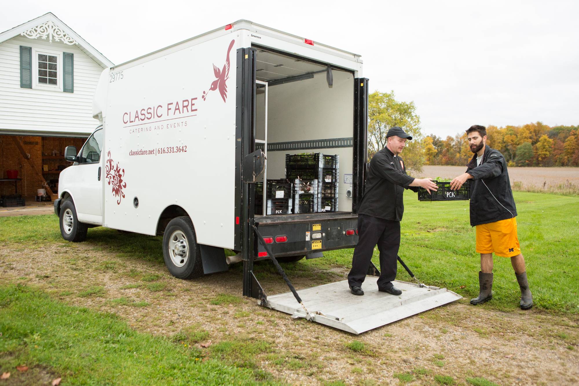 farm manager loads campus dining truck with produce from the SAP